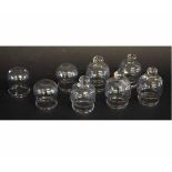 Group of eight clear glass cupping cups, each 7cms tall