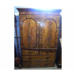 19th century mahogany linen press fitted with two arched panelled cupboard doors over two full width