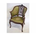 Edwardian mahogany bow back armchair with open work back splat and flanked either side by panels,