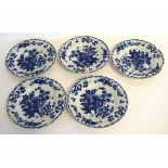 Set of five 18th century Dutch Delft blue and white plates with floral decorated borders and centres