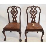 Set of four reproduction mahogany dining chairs with pierced open back splats, with leather drop