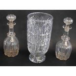Pair of Georgian clear glass decanters with a ribbed body and circular collar with matching