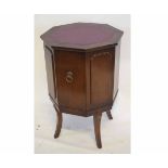 20th century hexagonal formed cupboard with panelled sides and purple rexine insert top, raised on
