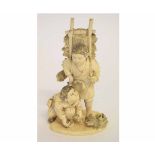 Japanese ivory okimono carved as two young boys gathering brushwood, 14cms high