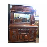 19th century walnut mirror back sideboard with open shelves with Corinthian column supports, the