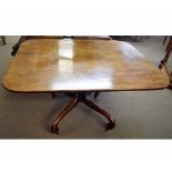 Georgian mahogany rectangular tilt-top breakfast table with ring turned column on a shaped scrolling