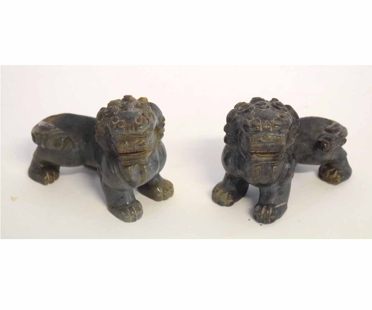 Pair of small soapstone temple dogs with decorative carving, 10cms long x 7cms tall