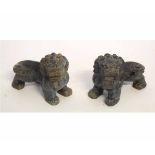 Pair of small soapstone temple dogs with decorative carving, 10cms long x 7cms tall