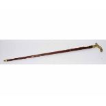 20th century teak three-sectional walking stick with brass handle and built-in flask, 88cms