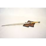 Replica Legolas sword with etched blade and a horn-style handle, together with a shield mount,