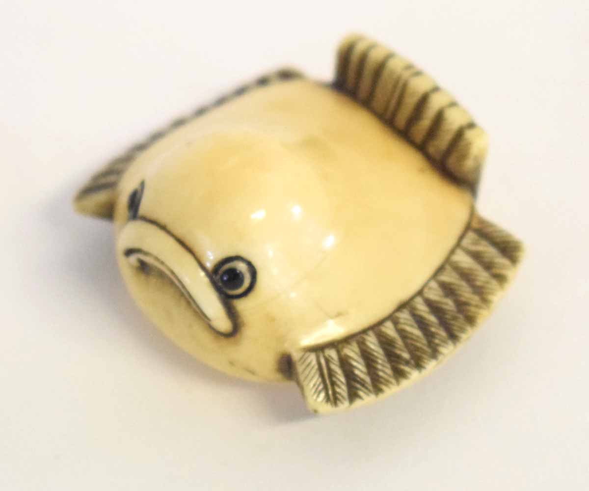 Japanese ivory netsuke carved as a stylised sparrow, signed to base