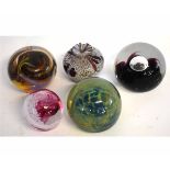 Group of four assorted paperweights to include a Mdina paperweight, Wedgwood, Royal Commemorative