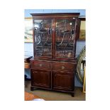 Georgian mahogany secretaire bookcase with two glazed doors and urn formed detail and fleur de lys