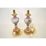 Mock Sevres gilt mounted electric lamps, with printed scenes of a gallant and his lady, 40cms