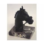 Bronze head of a horse with bridle, mounted on stone base by Anne Bushall