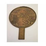 Large Japanese bronze hand mirror with case decoration of cranes among pine trees, 35cms long