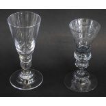 Large clear glass Bohemian goblet with knopped stem with etched detail, together with one other,