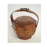 Decorative hexagonal Oriental lacquered and painted food box with top handle, 35cms tall