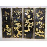 Four decorative Japanese modern lacquered panels with raised relief of cranes among pine trees, each