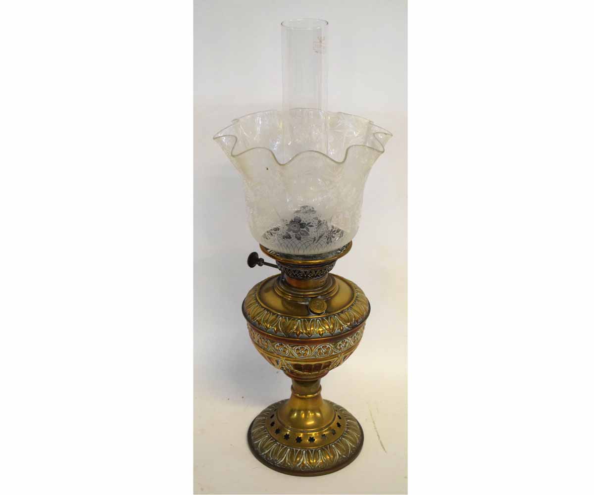 Victorian pressed brass oil lamp with decorative floral detailing, together with a further etched