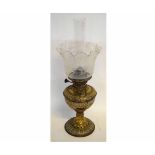 Victorian pressed brass oil lamp with decorative floral detailing, together with a further etched