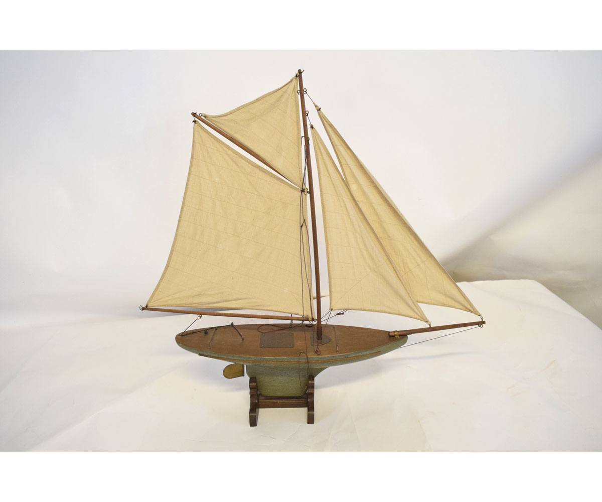 Late 19th/early 20th century pond yacht and stand with a painted hull and fitted with four