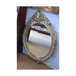 Modern large silver oval wall hanging mirror with acanthus leaf mounted top and rococo moulded