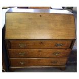 Late 18th century oak large proportioned bureau with drop front with fitted interior over three full