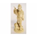 Japanese ivory okimono depicting a grape farmer and his son, 19cms tall