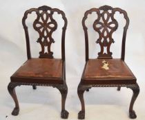 Set of four reproduction mahogany dining chairs with pierced open back splats, with leather drop