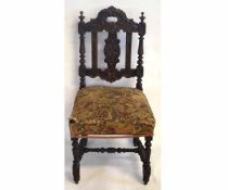 19th century Gothic oak carved hall chair with needlepoint seat (a/f) with heavily carved back