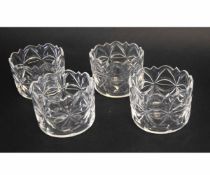 Set of four clear cut glass and shaped edge finger bowls, each 11cms diam