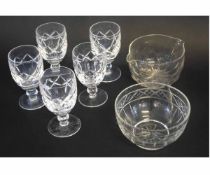 Set of five Waterford small water beakers with cut glass decoration on a clear foot, together with