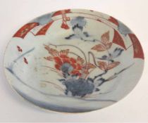 19th century Japanese dish, decorated in red and blue enamels, 22cms diam