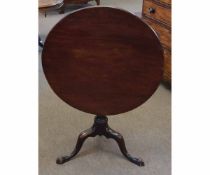 Georgian mahogany circular tilt top table with turned column supported by a tripod base, 76cms