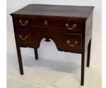 18th century oak lowboy fitted with three drawers with central carved arch with brass swan neck