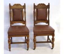 Set of five Edwardian oak dining chairs with brown rexine upholstered seat and back and carved top