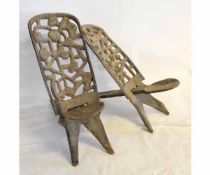 Pair of African carved back stools with spoon style seats with African carved figures to back