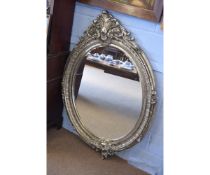 Modern large silver oval wall hanging mirror with acanthus leaf mounted top and rococo moulded