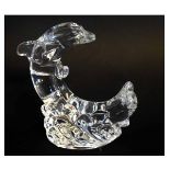Waterford paperweight modelled as a crescent of two dolphins among waves, 20cms tall