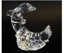 Waterford paperweight modelled as a crescent of two dolphins among waves, 20cms tall