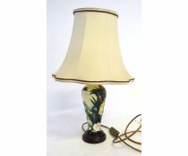 Decorative modern Moorcroft electric lamp with matching cream shade, body of lilies among bulrushes,