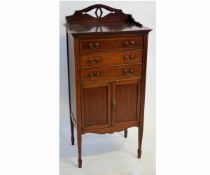 Edwardian mahogany and satinwood inlaid music cupboard fitted with three drawers with drop fronts,