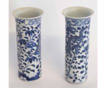 Pair of Chinese blue and white vases decorated with a dragon amongst foliage, four-character mark to