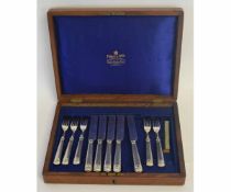 Oak cased part set of Mappin & Webb cutlery comprising five knives and five forks