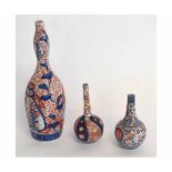 Collection of three Japanese porcelain vases decorated in Imari style, largest 30cms high