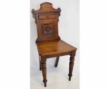 Victorian oak carved panel back hall chair with hard seat and ring turned legs