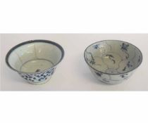 Two Chinese bowls decorated in blue and white style, largest 16cms diam