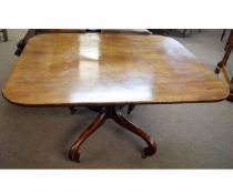 Georgian mahogany rectangular tilt-top breakfast table with ring turned column on a shaped scrolling