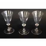 Three 19th century conical ale glasses on a circular foot with knopped stem, each 13cms tall